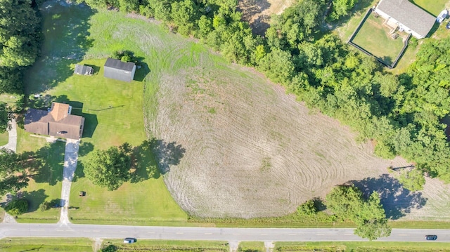 birds eye view of property featuring a rural view