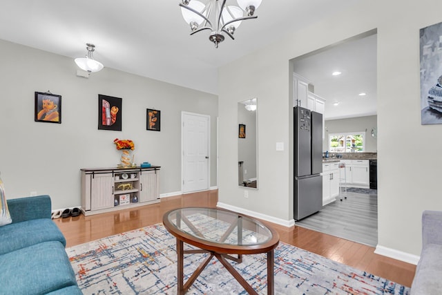7644 High Maple Cir N, Charleston, SC 29418 - living room featuring light wood-type flooring, a chandelier, and recessed lighting