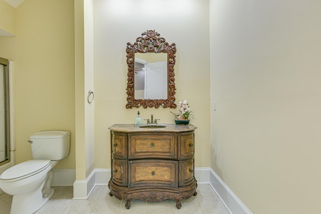 bathroom with tile patterned floors, vanity, and toilet