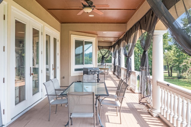 view of patio featuring ceiling fan and french doors