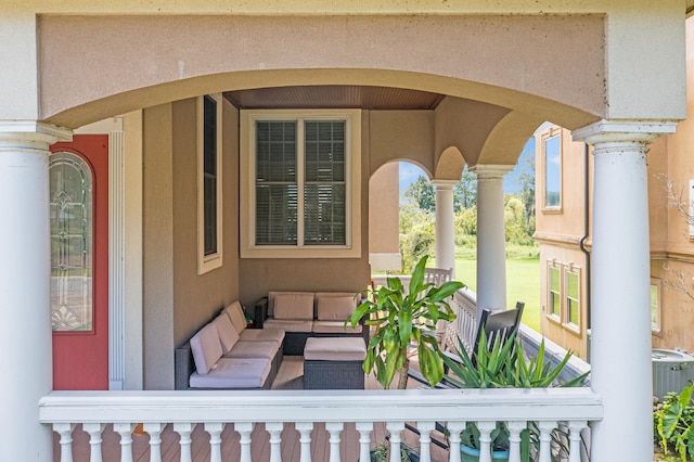 view of exterior entry with an outdoor living space