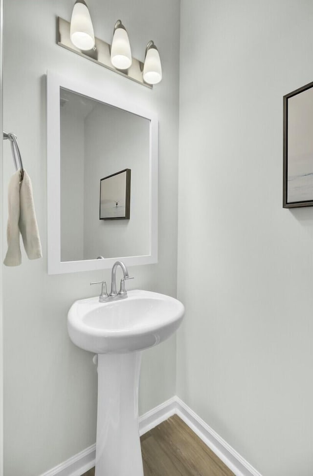 bathroom featuring sink and hardwood / wood-style floors