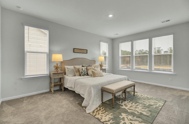 bedroom featuring light carpet