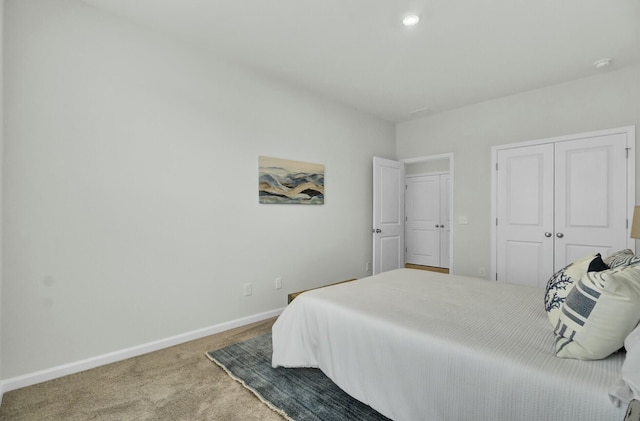 carpeted bedroom featuring a closet