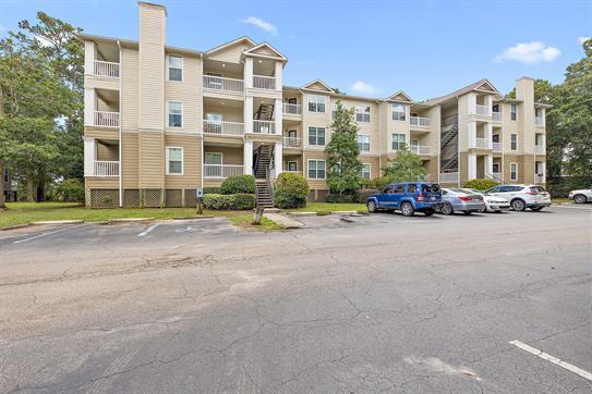 700 Daniel Ellis Dr Unit 11302, Charleston, SC 29412 - view of apartment building / complex with uncovered parking