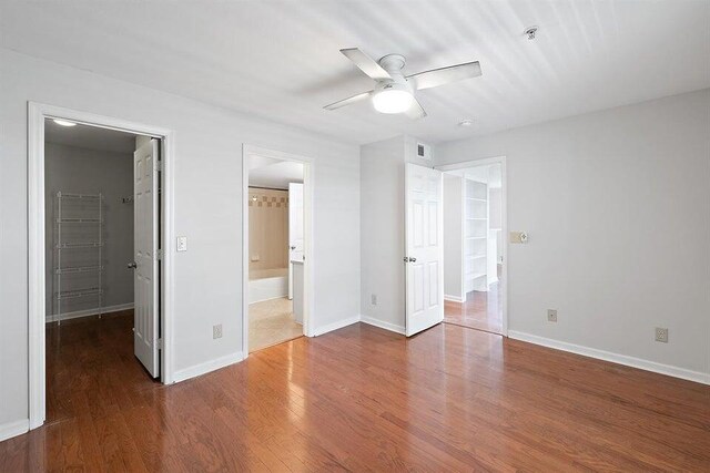700 Daniel Ellis Dr Unit 11302, Charleston, SC 29412 - unfurnished bedroom with a spacious closet, wood finished floors, baseboards, and ensuite bathroom