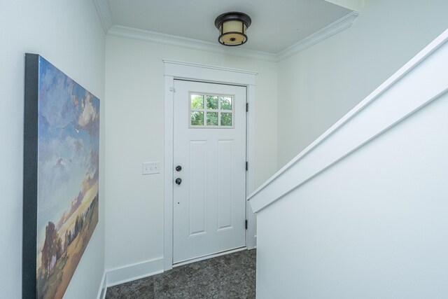 foyer entrance with ornamental molding, baseboards, and granite floors