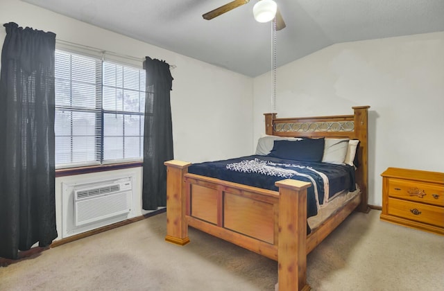 bedroom with lofted ceiling, a wall unit AC, ceiling fan, and carpet flooring