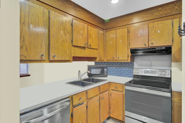 kitchen featuring tasteful backsplash, appliances with stainless steel finishes, and sink