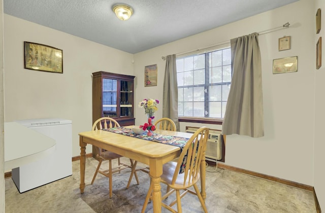 dining room featuring a textured ceiling