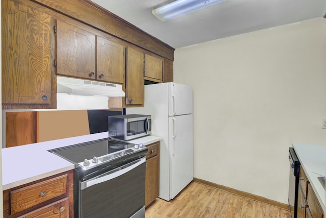 kitchen with appliances with stainless steel finishes and light wood-type flooring