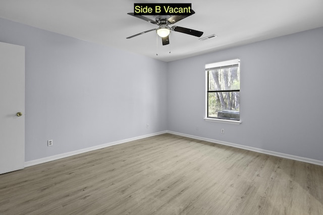 unfurnished room featuring ceiling fan, wood finished floors, visible vents, and baseboards