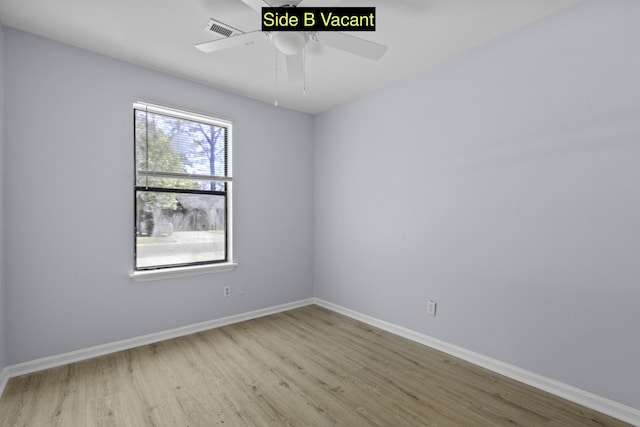 unfurnished room featuring ceiling fan, wood finished floors, visible vents, and baseboards