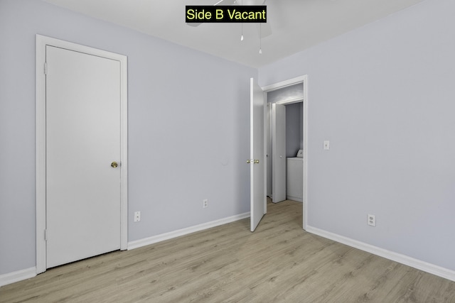 unfurnished bedroom with baseboards and wood finished floors