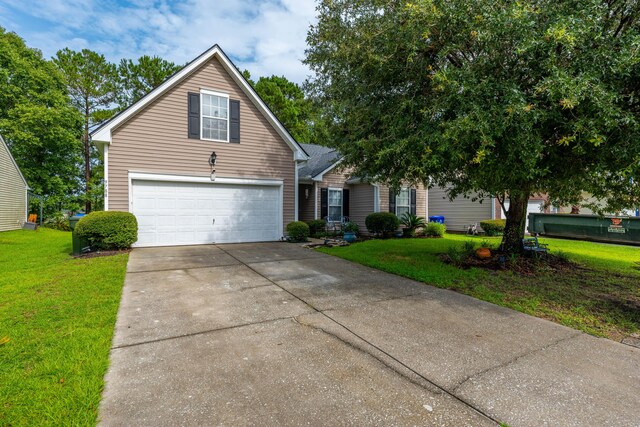 view of front facade with a garage and a front lawn