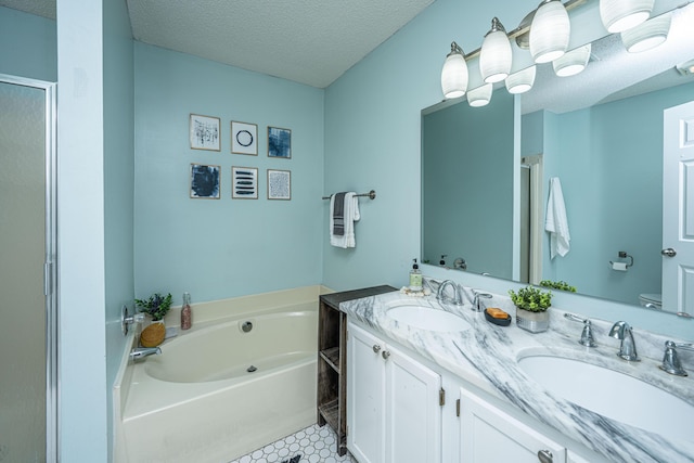 1918 Piper Dr, Charleston, SC 29407 - bathroom with a textured ceiling, a garden tub, a stall shower, toilet, and double vanity
