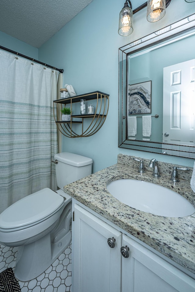 1918 Piper Dr, Charleston, SC 29407 - full bathroom with toilet, vanity, and a textured ceiling