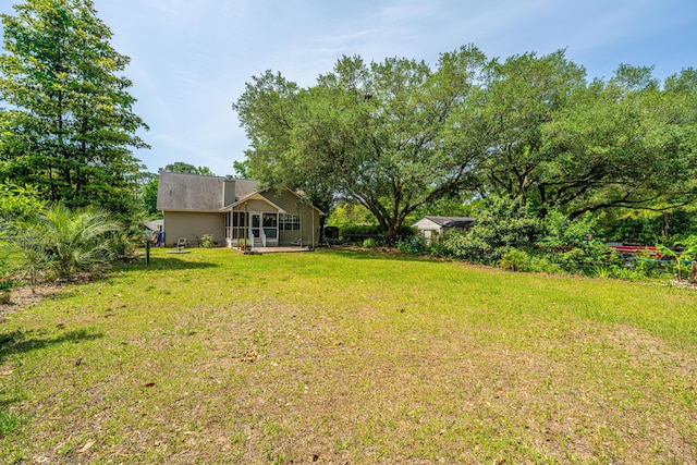 1918 Piper Dr, Charleston, SC 29407 - view of grassy yard with a sunroom