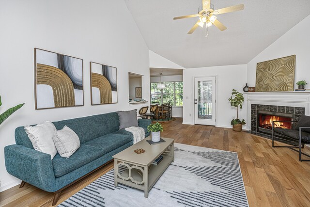 1918 Piper Dr, Charleston, SC 29407 - living room with wood finished floors, ceiling fan, a fireplace, baseboards, and high vaulted ceiling