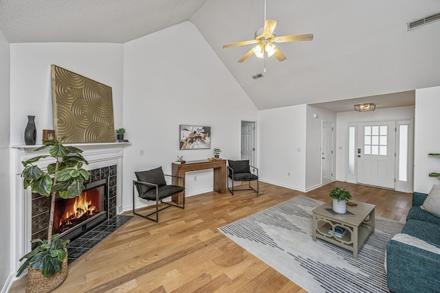 1918 Piper Dr, Charleston, SC 29407 - living area with a fireplace, ceiling fan, wood finished floors, high vaulted ceiling, and baseboards