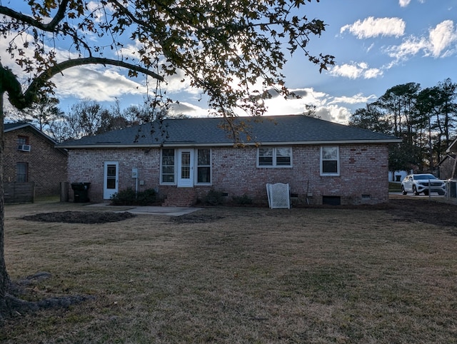 back of house featuring a yard