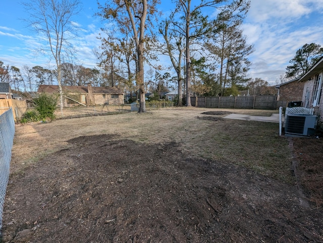 view of yard with central AC