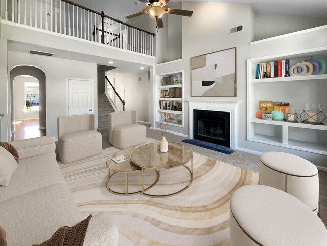 kitchen featuring white cabinetry, appliances with stainless steel finishes, a chandelier, and a kitchen island