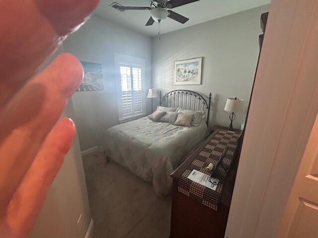 bedroom with carpet flooring and a ceiling fan