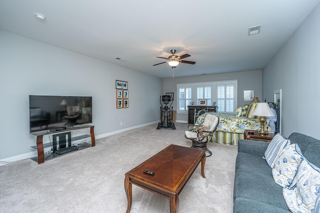 carpeted living room featuring baseboards, ceiling fan, and visible vents