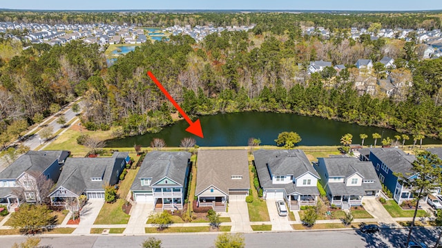 drone / aerial view with a residential view and a water view