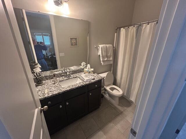 full bathroom with toilet, tile patterned floors, vanity, and a shower with curtain