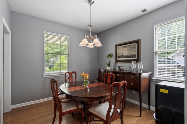 1431 Whispering Oak Trl, Mount Pleasant, SC 29466 - dining space with a chandelier, light wood-style floors, and heating unit