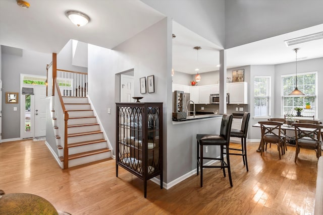 1431 Whispering Oak Trl, Mount Pleasant, SC 29466 - staircase featuring wood finished floors and healthy amount of natural light