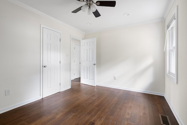 unfurnished bedroom with ceiling fan, dark hardwood / wood-style floors, and crown molding