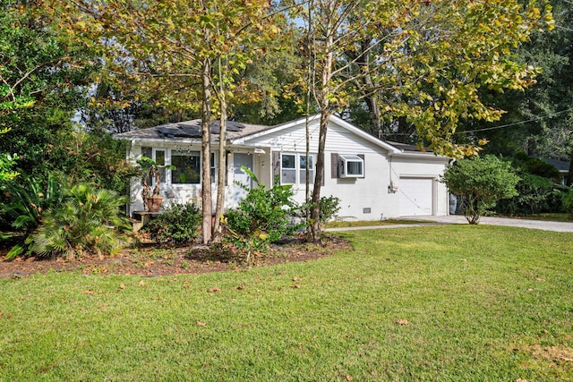 single story home featuring a garage and a front lawn