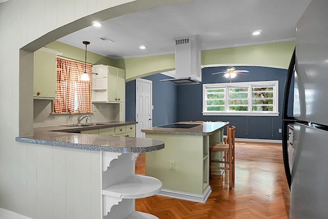 kitchen featuring stainless steel fridge, light parquet floors, ceiling fan, hanging light fixtures, and kitchen peninsula