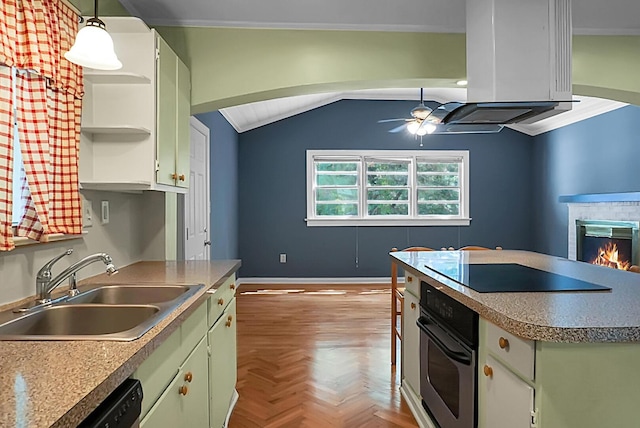 kitchen featuring sink, hanging light fixtures, ceiling fan, light parquet flooring, and black appliances