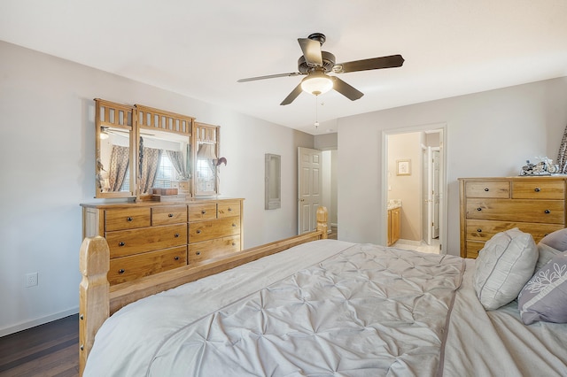 bedroom with ceiling fan, ensuite bath, wood finished floors, and baseboards