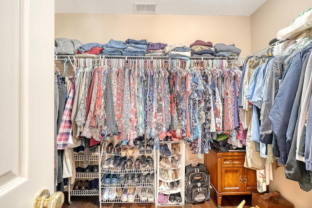 spacious closet with visible vents and wood finished floors