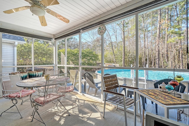 sunroom with a ceiling fan