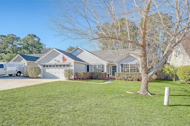 ranch-style home featuring an attached garage, fence, concrete driveway, and a front yard