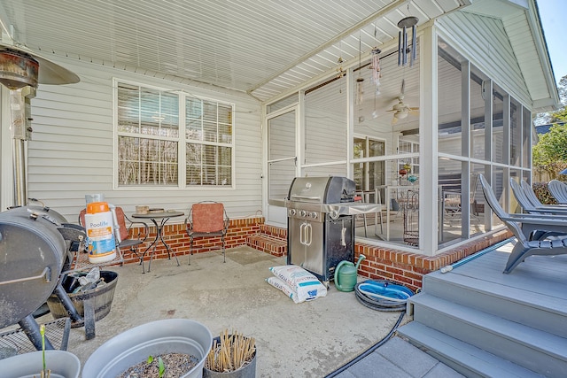 view of patio / terrace with a sunroom and area for grilling