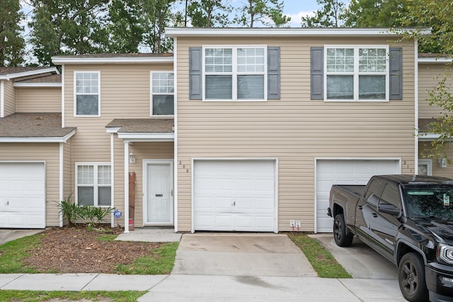 townhome / multi-family property featuring a garage