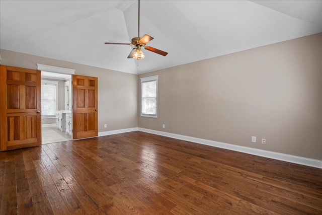 interior space featuring ceiling fan, wood-type flooring, and lofted ceiling