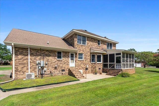 back of house with a yard, a patio, cooling unit, and a sunroom