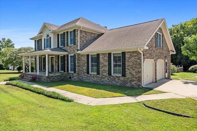 view of front facade featuring covered porch, a garage, and a front lawn