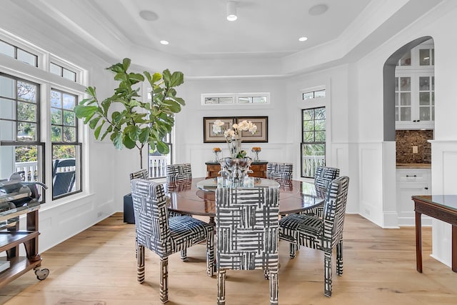 1913 Mooring Line Way, Mount Pleasant, SC 29466 - dining area featuring light wood-style floors, arched walkways, ornamental molding, and a decorative wall