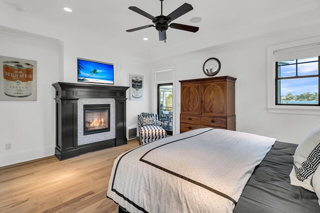 1913 Mooring Line Way, Mount Pleasant, SC 29466 - bedroom featuring a ceiling fan, light wood-type flooring, baseboards, a glass covered fireplace, and recessed lighting
