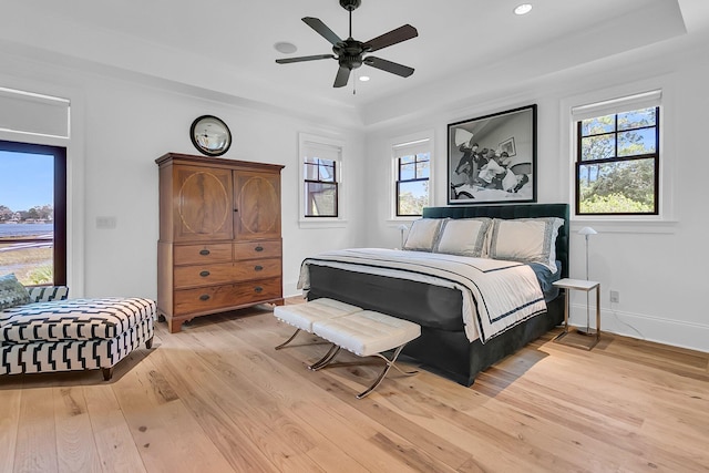 1913 Mooring Line Way, Mount Pleasant, SC 29466 - bedroom featuring light wood-style floors, recessed lighting, a ceiling fan, baseboards, and a tray ceiling