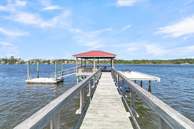 view of dock featuring a gazebo and a water view